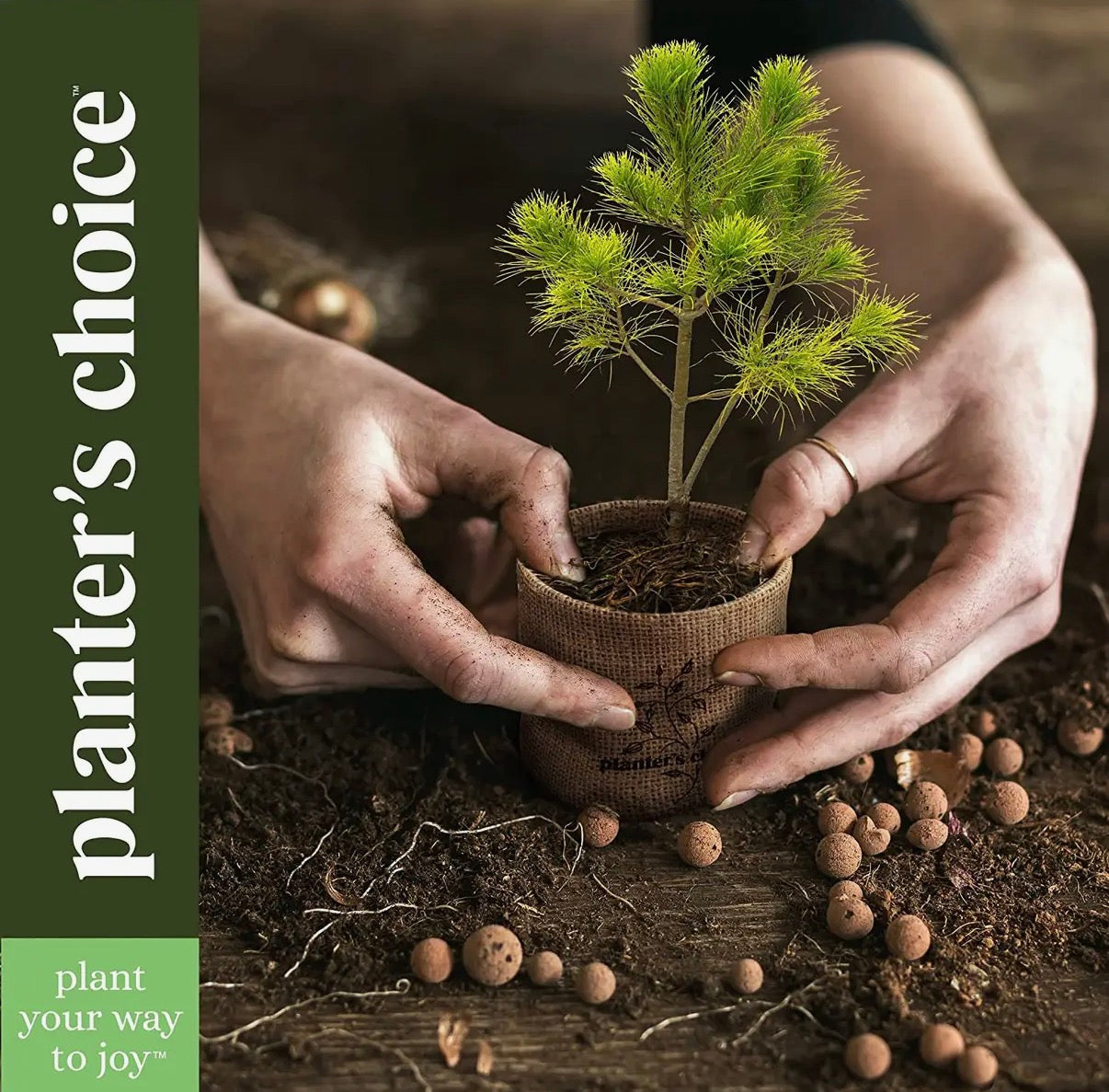 Two hands holding a small potted plant with 'planter's choice' text on a natural background.
