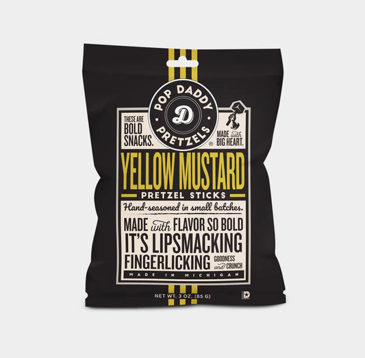 Black packaging of Pop Daddy Yellow Mustard Pretzel Sticks with yellow text on a white background