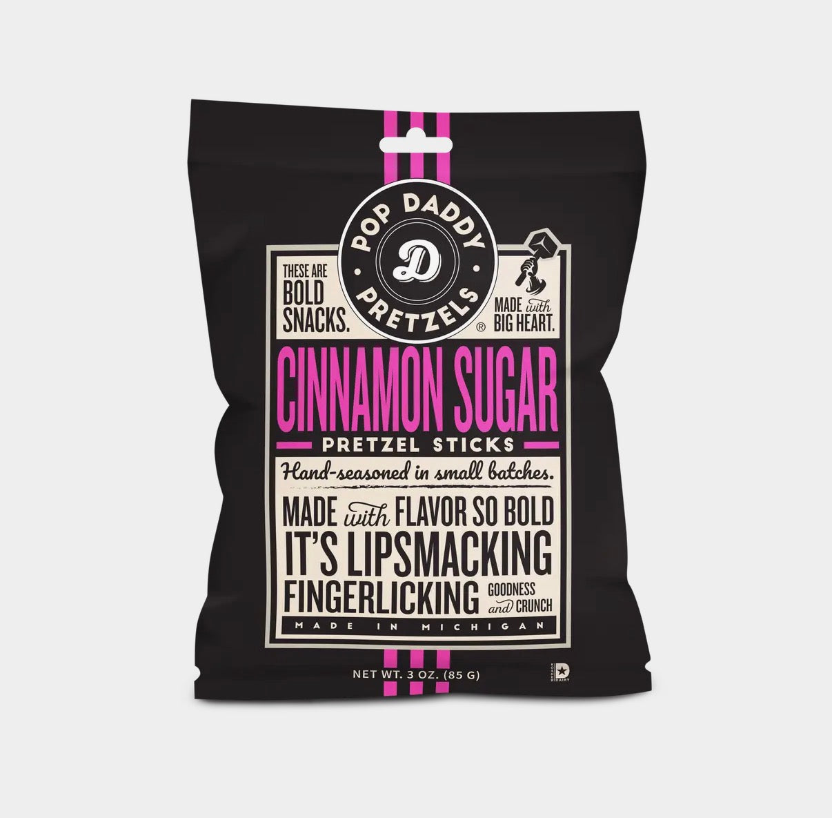 Black packaging of Pop Daddy Cinnamon Sugar Pretzel Sticks with pink and white text on a light gray background