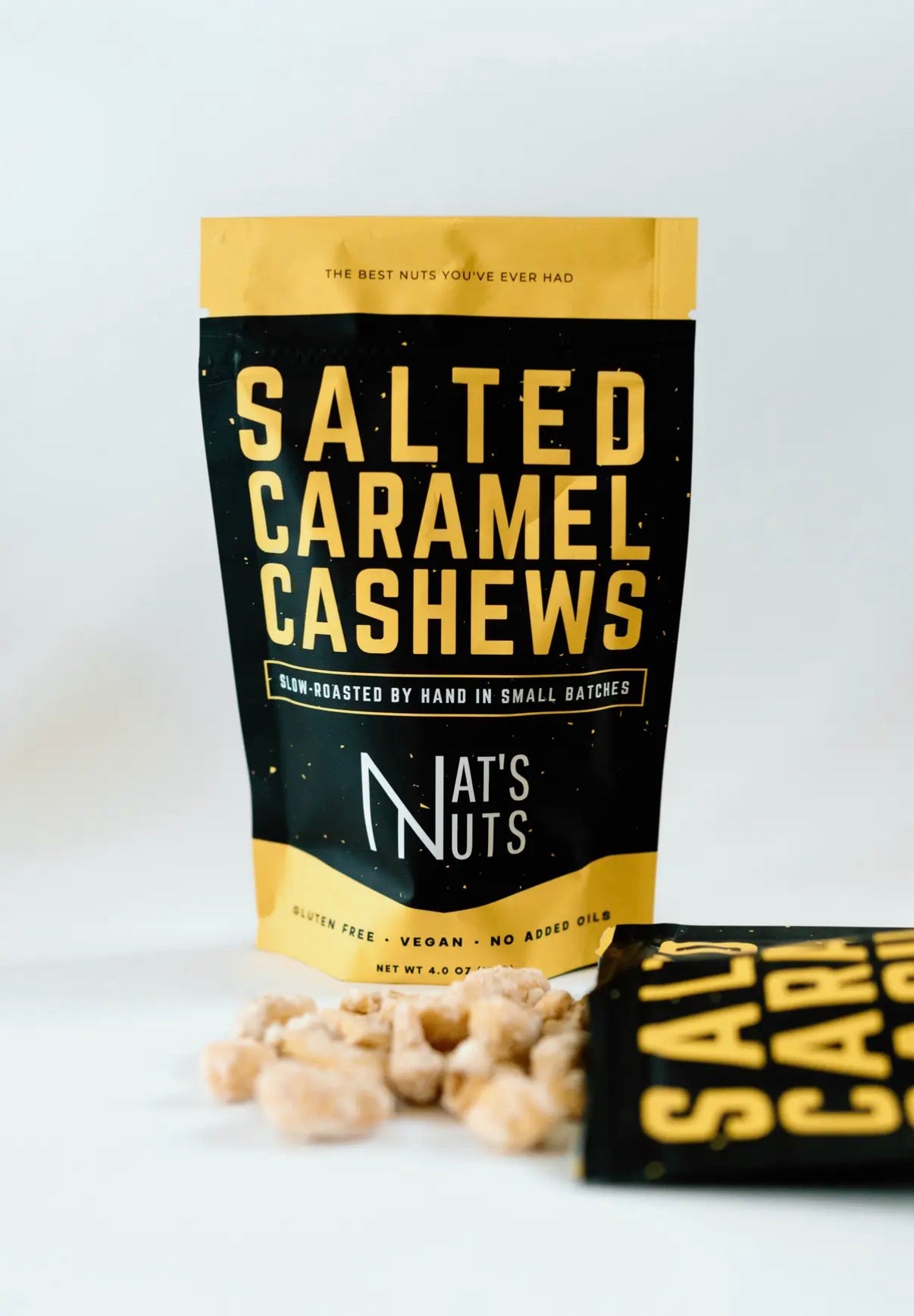 Packaged salted caramel cashews with 'Nat's Nuts' branding on a white background